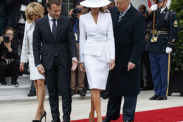 From right, President Donald Trump, first lady Melania Trump, French President Emmanuel Macron and his wife Brigitte Macron, take their positions for a photograph during a State Arrival Ceremony on the South Lawn of the White House in Washington, Tuesday, April 24, 2018. (AP Photo/Carolyn Kaster)
