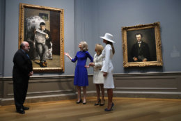 First lady Melania Trump, right, and Brigitte Macron, wife of French President Emmanuel Macron, tour the National Gallery of Art, Tuesday April 24, 2018, with Mary Morton, center, and Frank Kelly, far left, in Washington. (AP Photo/Jacquelyn Martin)