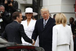 President Donald Trump and first lady Melania Trump welcome French President Emmanuel Macron and his wife Brigitte Macron during a State Arrival Ceremony on the South Lawn of the White House in Washington, Tuesday, April 24, 2018. (AP Photo/Carolyn Kaster)