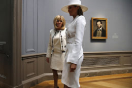 First lady Melania Trump, right, and Brigitte Macron, wife of French President Emmanuel Macron, tour the National Gallery of Art, Tuesday April 24, 2018, in Washington. (AP Photo/Jacquelyn Martin)