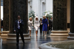First lady Melania Trump, center, and Brigitte Macron, left, wife of French President Emmanuel Macron, tour the National Gallery of Art with the museum's Mary Morton, Tuesday April 24, 2018, in Washington. (AP Photo/Jacquelyn Martin)
