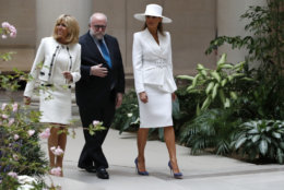 First lady Melania Trump, right, and Brigitte Macron, wife of French President Emmanuel Macron, left, tour the National Gallery of Art with the museum's Frank Kelly, Tuesday April 24, 2018, in Washington. (AP Photo/Jacquelyn Martin)