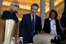 French President Emmanuel Macron and his wife Brigitte speak with historians and curators during their visit to the Library of Congress in Washington, on Wednesday, April 25, 2018. ( AP Photo/Jose Luis Magana)