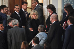 Brigitte Macron, center, wife of French President Emmanuel Macron, waves to guests as she prepares to leave after her husband's address to a joint meeting of Congress on Capitol Hill in Washington, Wednesday, April 25, 2018. (AP Photo/Pablo Martinez Monsivais)