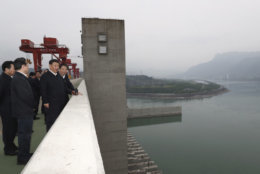 In this April 24, 2018 photo released by China's Xinhua News Agency, Chinese President Xi Jinping, second from right, visits the Three Gorges Dam, the world's largest hydropower project, on the Yangtze River near Yichang in central China's Hubei Province. Xi was on an inspection tour of Hubei Province, according to Chinese state media. (Ju Peng/Xinhua via AP)