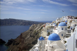 This Sept. 21, 2009 photo shows a view of Oia village on the island of Santorini, Greece. The Greek island of Santorini offers seaside tavernas, cliffside paths, black volcanic rocks and of course, sunshine and the Aegean.      (AP Photo/Michael Virtanen)