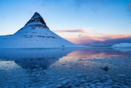 Kirkjufell is a beautifully shaped and a symmetric, free standing mountain in Iceland