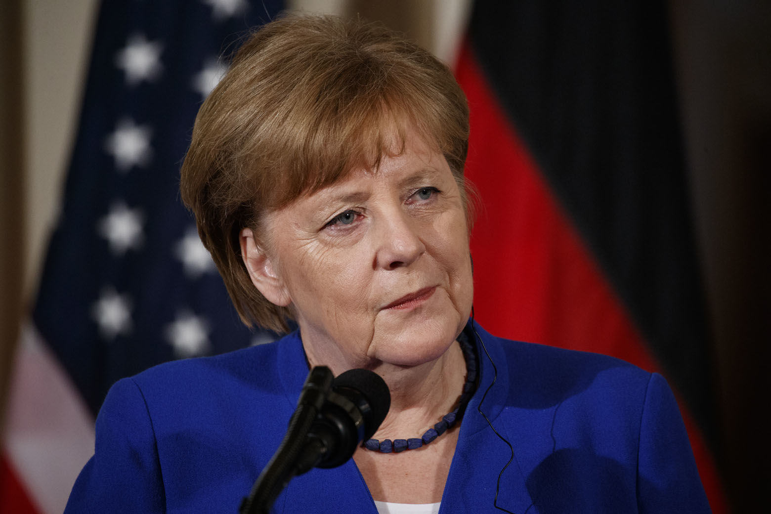German Chancellor Angela Merkel listens to a question during a news conference with President Donald Trump in the East Room of the White House, Friday, April 27, 2018, in Washington. (AP Photo/Evan Vucci)
