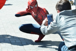 A man dressed as the character Spider Man poses for a passerby at Awesome Con 2018 at the Walter E. Washington Convention Center in Washington, D.C. (Shannon Finney)