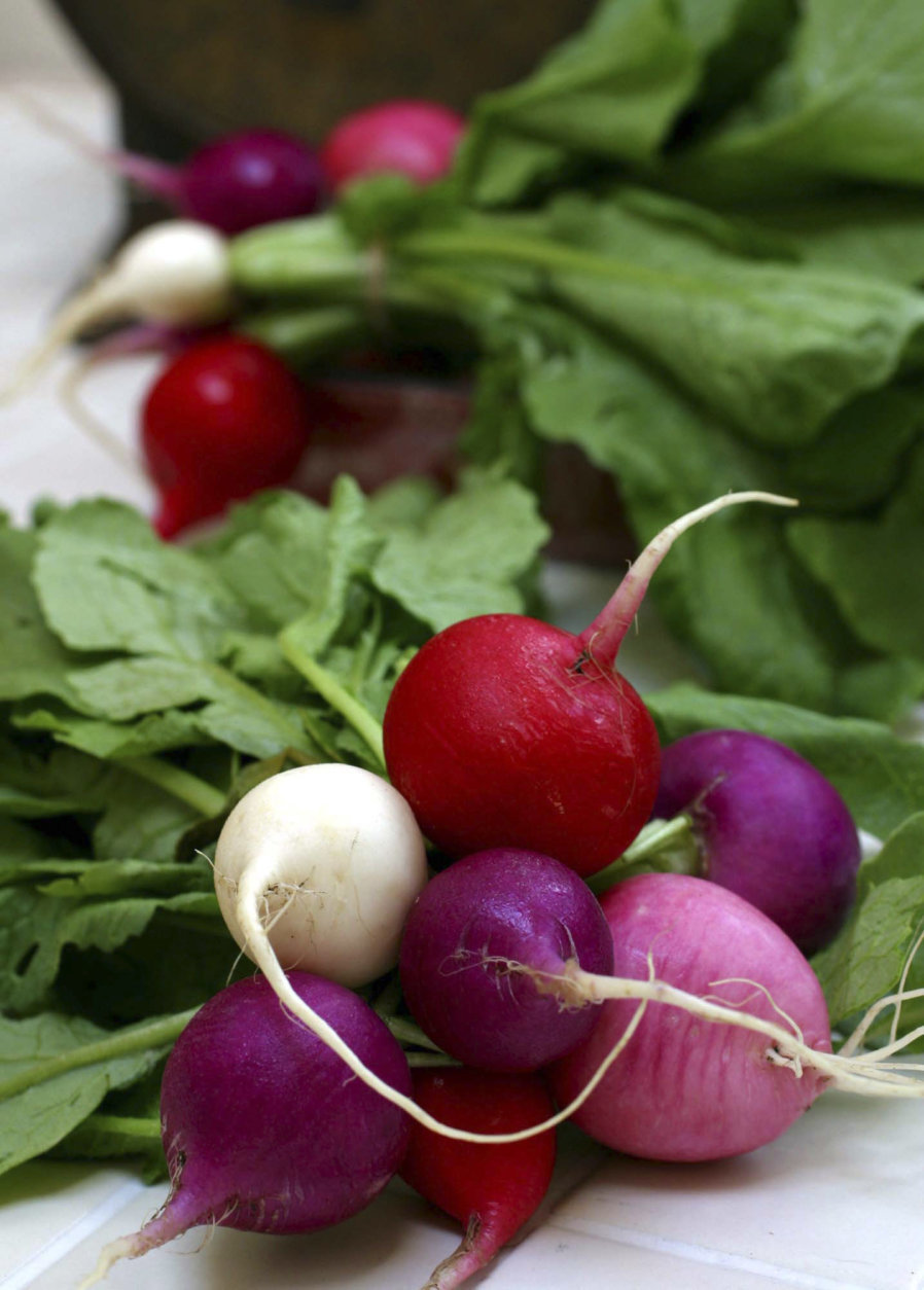 **FOR USE WITH AP LIFESTYLES**  **FILE**   This July 1, 2004 file photo shows radishes in a variety of colors, including red, purple, pink and white in Concord, N.H.  Vegetable gardening is not a dark science, nor the stuff of incantations and secretive weeding on moonless nights. But it does take a little planning.    (AP Photo/Larry Crowe, FILE)