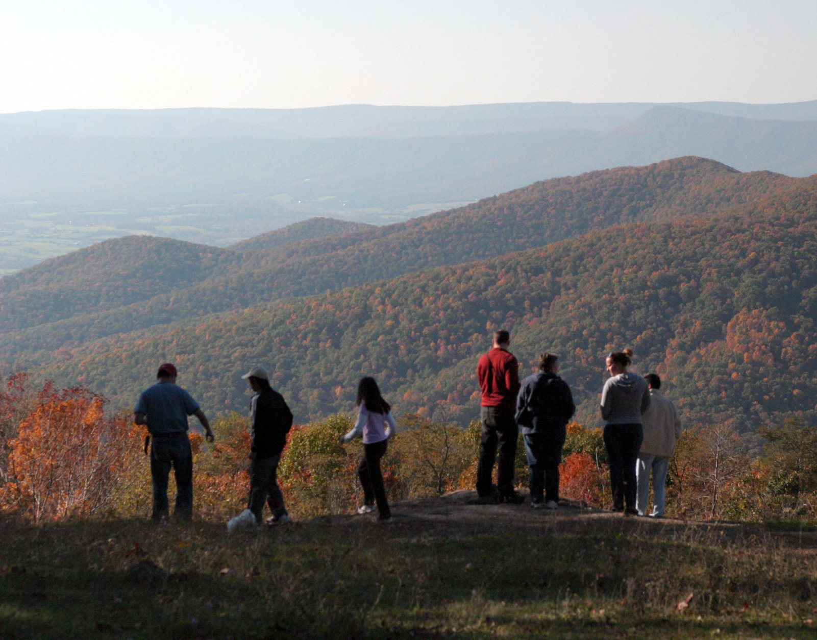 Viewers look out on autumn foliage from an overlook in Shenandoah National Park south of Front Royal. Va., Saturday, Oct. 21, 2006. (AP Photo/Robert Meyers)