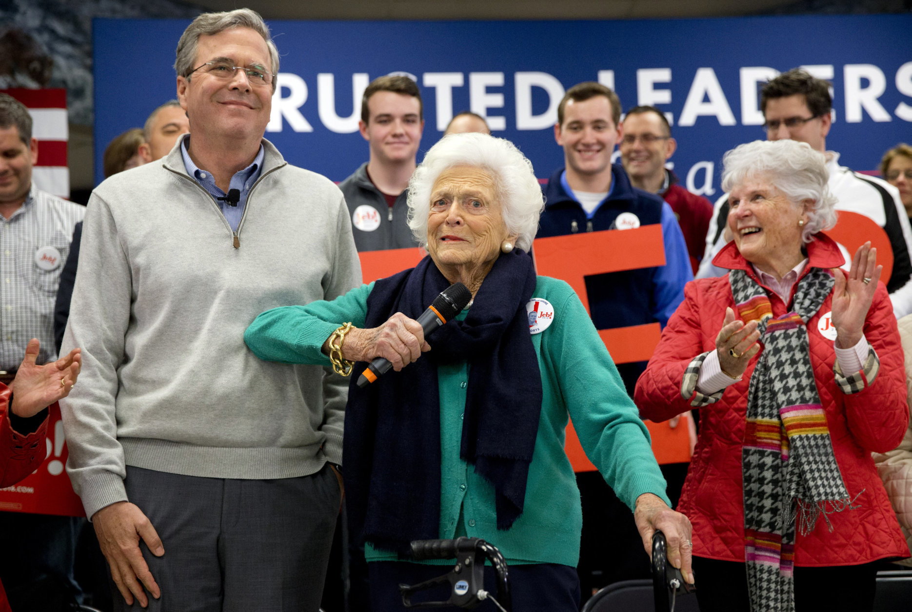 Barbara Bush, center, jokes with her son, Republican presidential candidate, former Florida Gov. Jeb Bush, while introducing him at a town hall meeting at West Running Brook Middle School in Derry, N.H., Thursday Feb. 4, 2016. (AP Photo/Jacquelyn Martin)