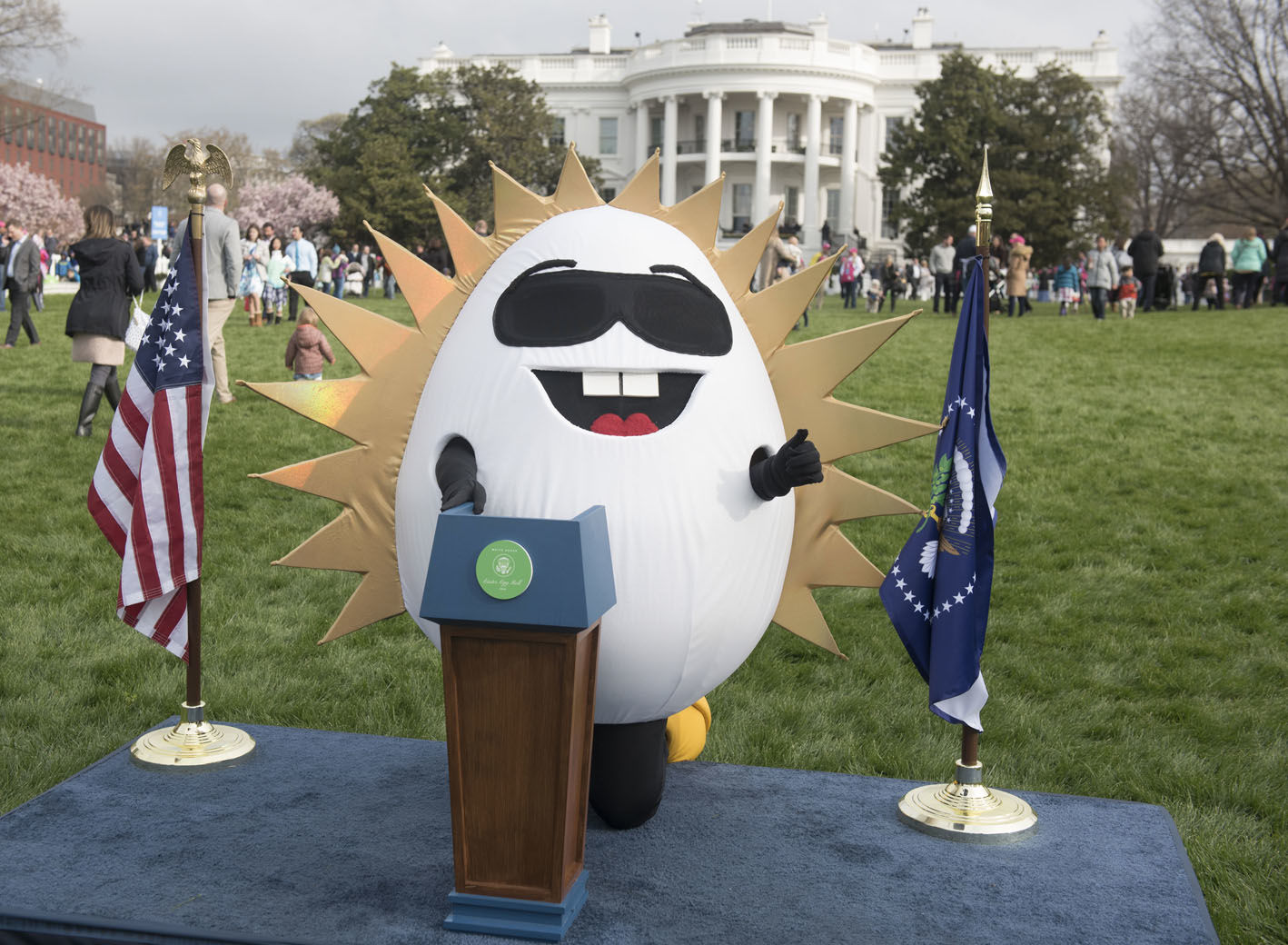 IMAGE DISTRIBUTED FOR AMERICAN EGG BOARD - The Incredible Egg mascot Eggy poses at a podium on the South Lawn at the 2018 White House Easter Egg Roll on Monday, April 2, 2018, in Washington. More than 30,000 eggs were provided by America's egg farmers for rolling, dyeing and sampling at the event, supported by American Egg Board. (Kevin Wolf/AP Images for American Egg Board)