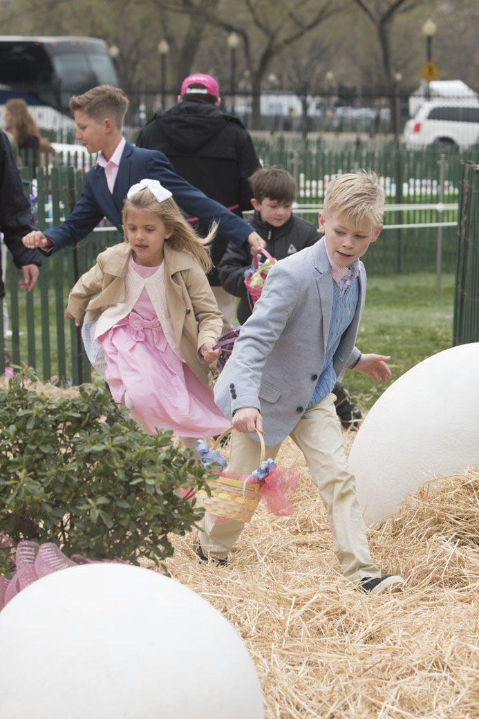 IMAGE DISTRIBUTED FOR AMERICAN EGG BOARD - Children take part in the 140th annual White House Easter Egg Roll by looking for some of the 30,000 real eggs provided by America's egg farmers on Monday, April 2, 2018, in Washington. (Kevin Wolf/AP Images for American Egg Board)