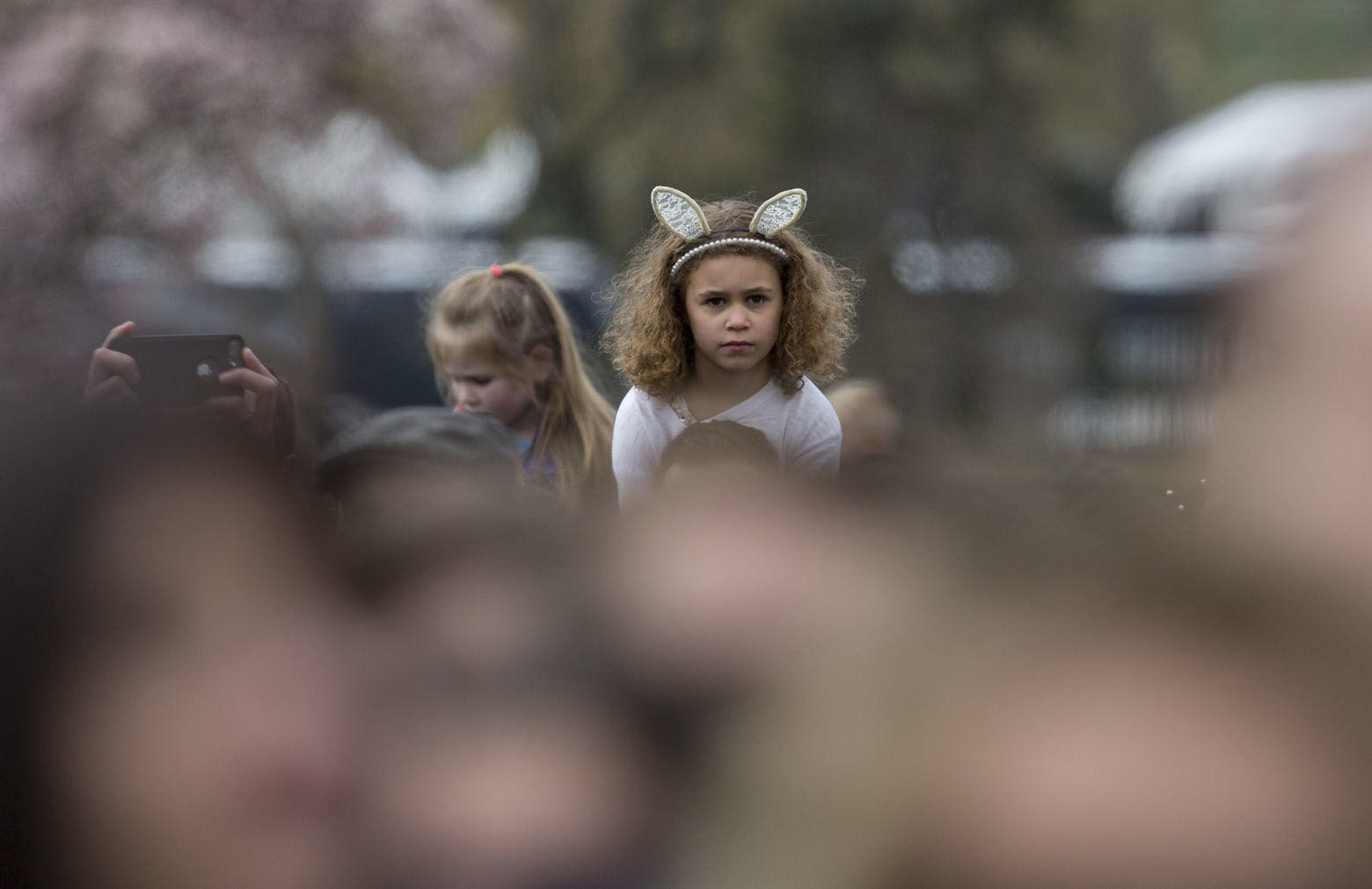 Kids are held high to see over the crowd as President Donald Trump and first lady Melania Trump participate in the annual White House Easter Egg Roll at the White House in Washington, Monday, April 2, 2018. (AP Photo/Carolyn Kaster)