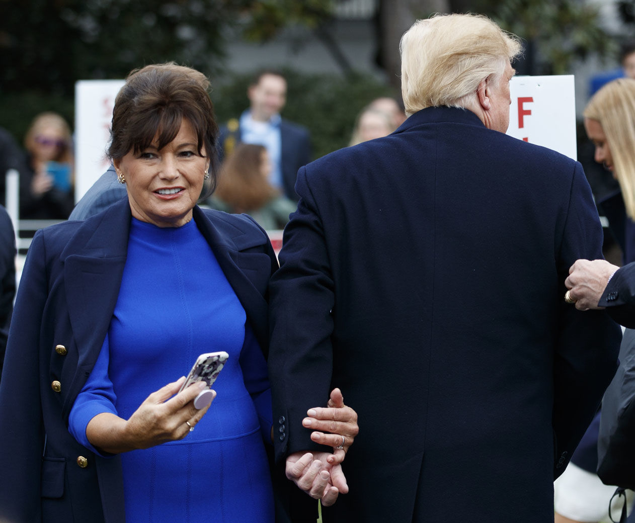 Amalija Knavs, mother of first lady Melania Trump greets President Donald Trump as he walks through the crowd at the White House in Washington, Monday, April 2, 2018, during the annual White House Easter Egg Roll. (AP Photo/Carolyn Kaster)