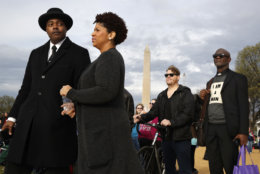Milton A. Williams, left, pastor of Pennsylvania Ave. AME Zion Church in Baltimore, Ruth LaToison Ifill, with AME Zion Church, Stephen Marencic, of Washington, and Aaron Ward, of Washington, attend the A.C.T. To End Racism rally, Wednesday, April 4, 2018, on the National Mall in Washington, on the 50th anniversary of Martin Luther King Jr.'s assassination. (AP Photo/Jacquelyn Martin)