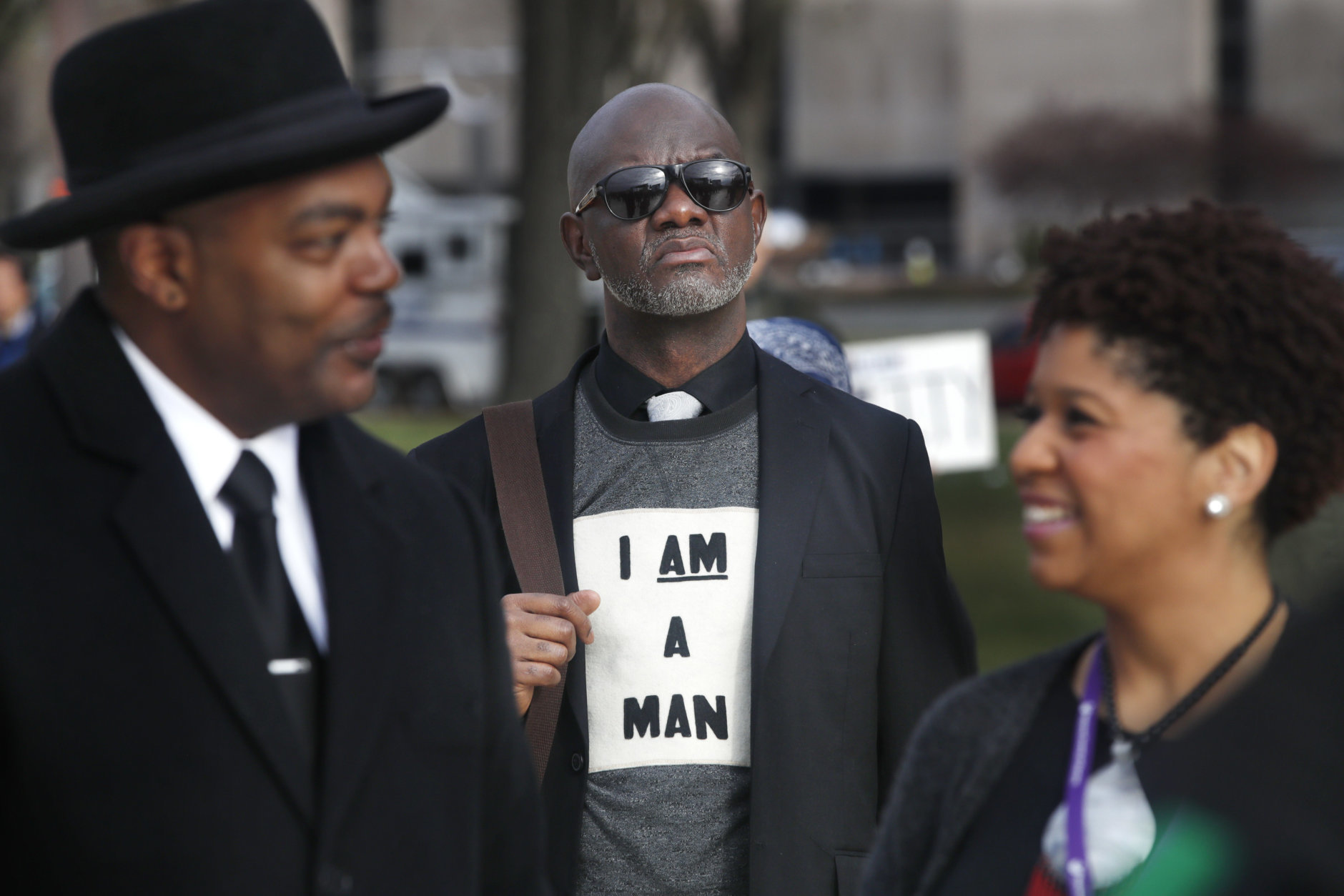 Aaron Ward, of Washington, center, attends the A.C.T. To End Racism rally, Wednesday, April 4, 2018, on the National Mall in Washington, on the 50th anniversary of Martin Luther King Jr.'s assassination. Milton A. Williams, left, pastor of Pennsylvania Ave. AME Zion Church in Baltimore and Ruth LaToison Ifill, with AME Zion Church, right. (AP Photo/Jacquelyn Martin)
