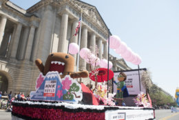 IMAGE DISTRIBUTED NHK WORLD - NHK WORLD-JAPAN's mascot, Domo, left, rides on a float with PBS Kid's Super Why! in the National Cherry Blossom Festival Parade on Saturday, April 14, 2018 in Washington. (Kevin Wolf/AP Images for NHK World)