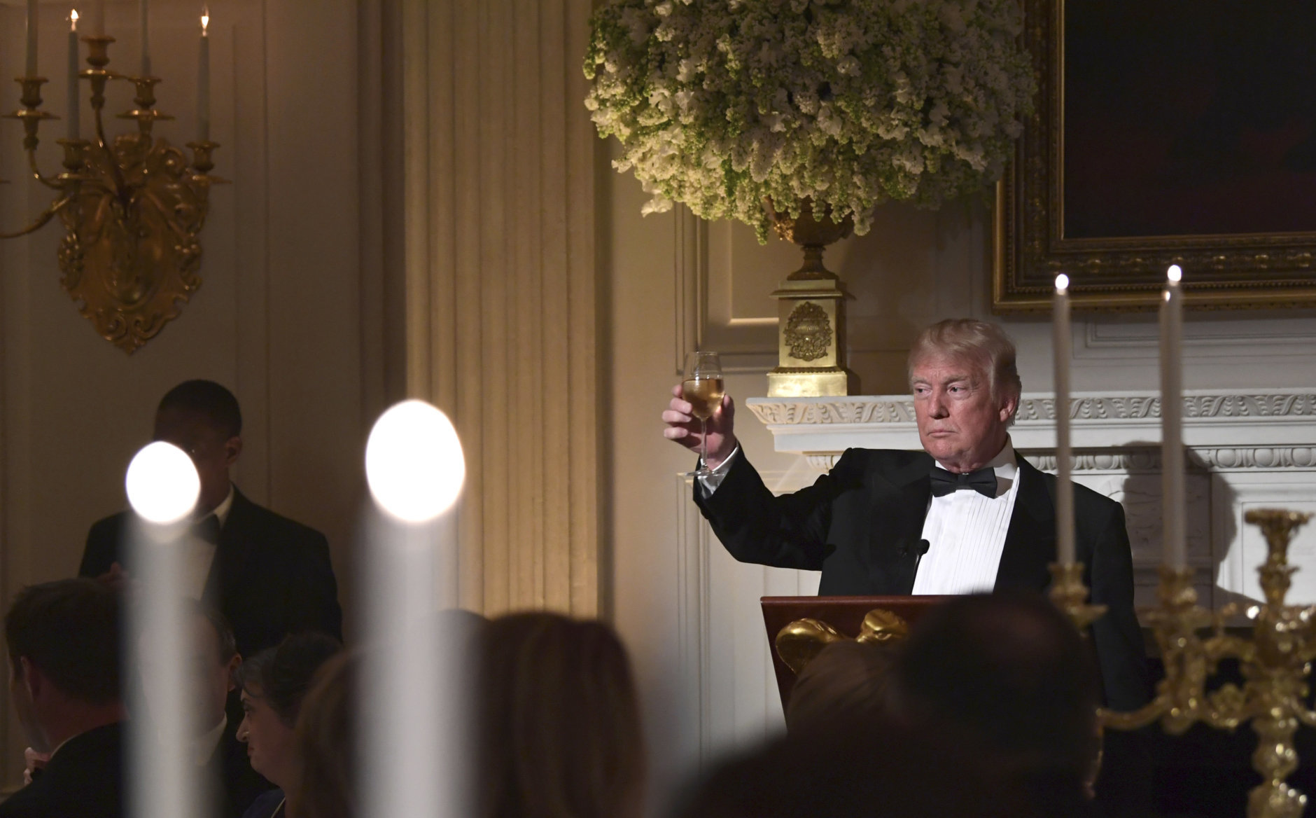 President Donald Trump offers up a toast to French President Emmanuel Macron during the State Dinner at the White House in Washington, Tuesday, April 24, 2018. (AP Photo/Susan Walsh)