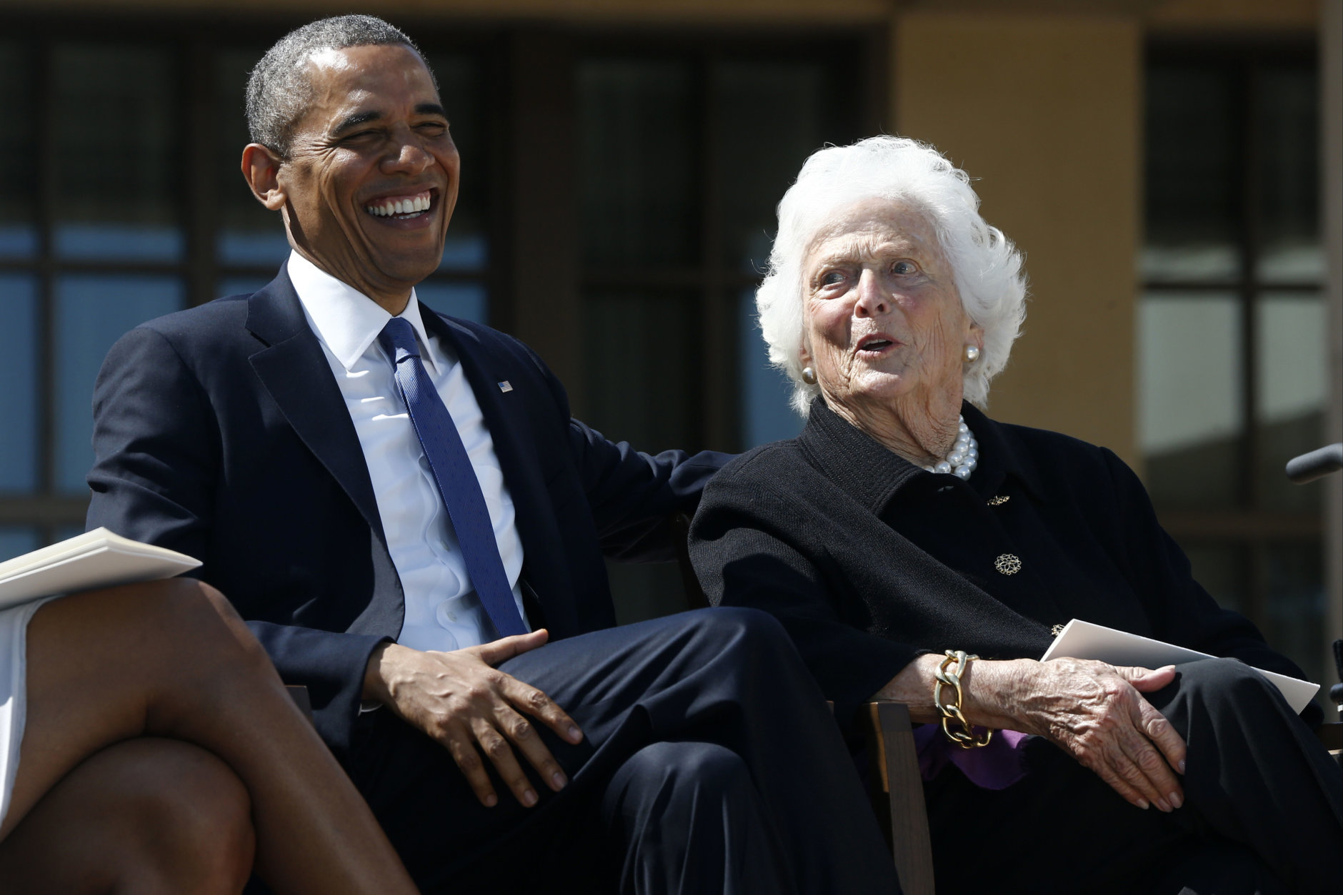 President Barack Obama shares a laugh with former first lady Barbara Bush at the dedication of the George W. Bush presidential library on the campus of Southern Methodist University in Dallas, Thursday, April 25, 2013. (AP Photo/Charles Dharapak)