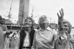 Nancy Reagan, left and Barbara Bush, right, wives of the GOP nominees for President and Vice President, plead to a crowd lining a balcony for their votes in this Novembers general election on Sept. 15, 1980 in Baltimore, Md.     The wives toured the Baltimore Inner Harbor while campaigning for their husbands. (AP Photo/William Smith)