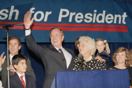Vice President George Bush and wife, Barbara, wave to supporters that turned out in Houston, Texas, to hear him announce he was a candidate for the Republican nomination for president of the United States, Oct. 12, 1987.  (AP Photo/Ed Kolenovsky)