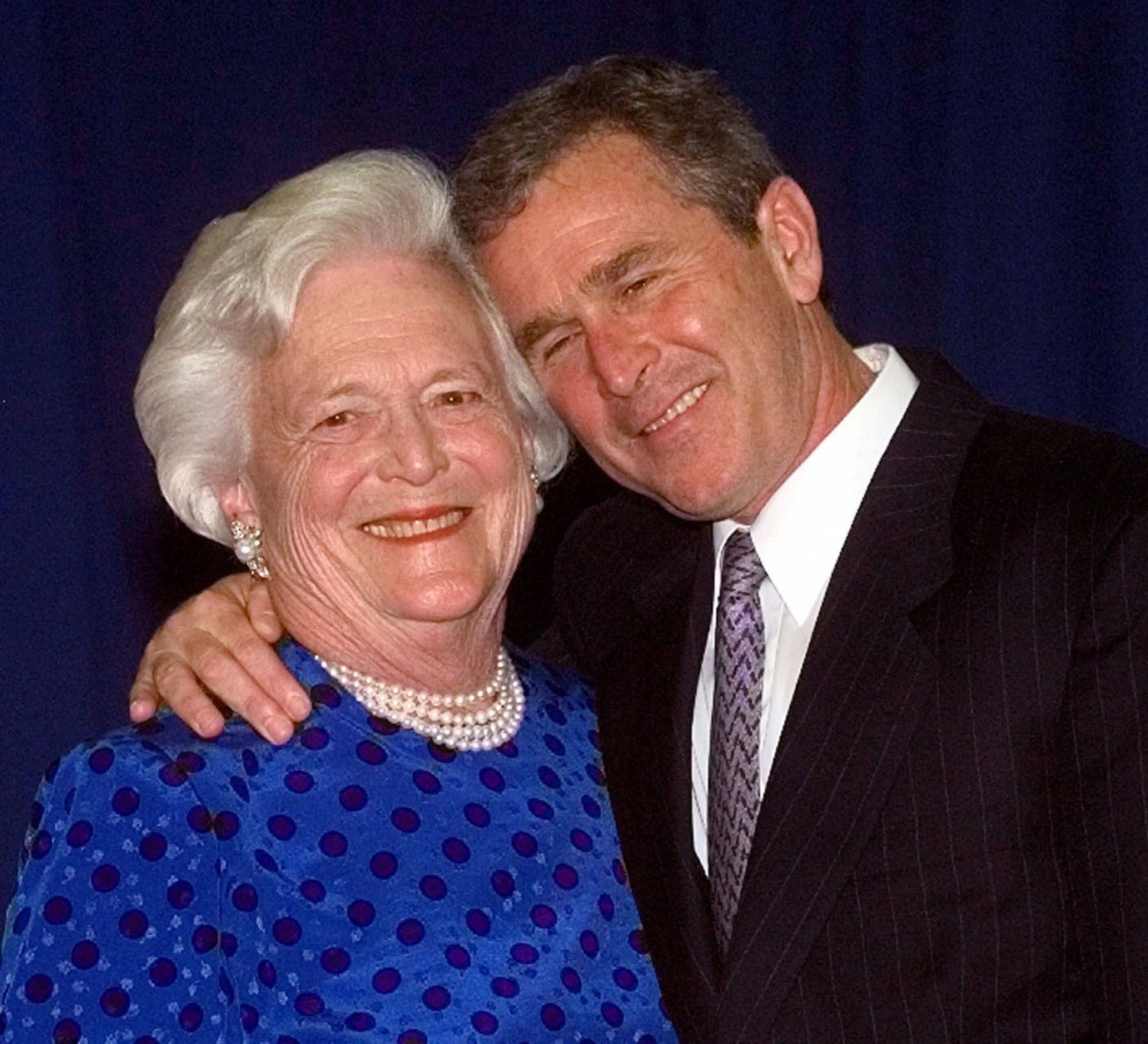 Texas Gov. George W. Bush, right, gives his mother, Barbara Bush , a hug after taking a family photo Thursday, June 10, 1999 in Houston. The Bush family gathered to celebrate former president George Bush and Barbara's birthdays. George Bush will turn 75 Saturday and Barbara turned 74 Tuesday. (AP Photo/David J. Phillip)