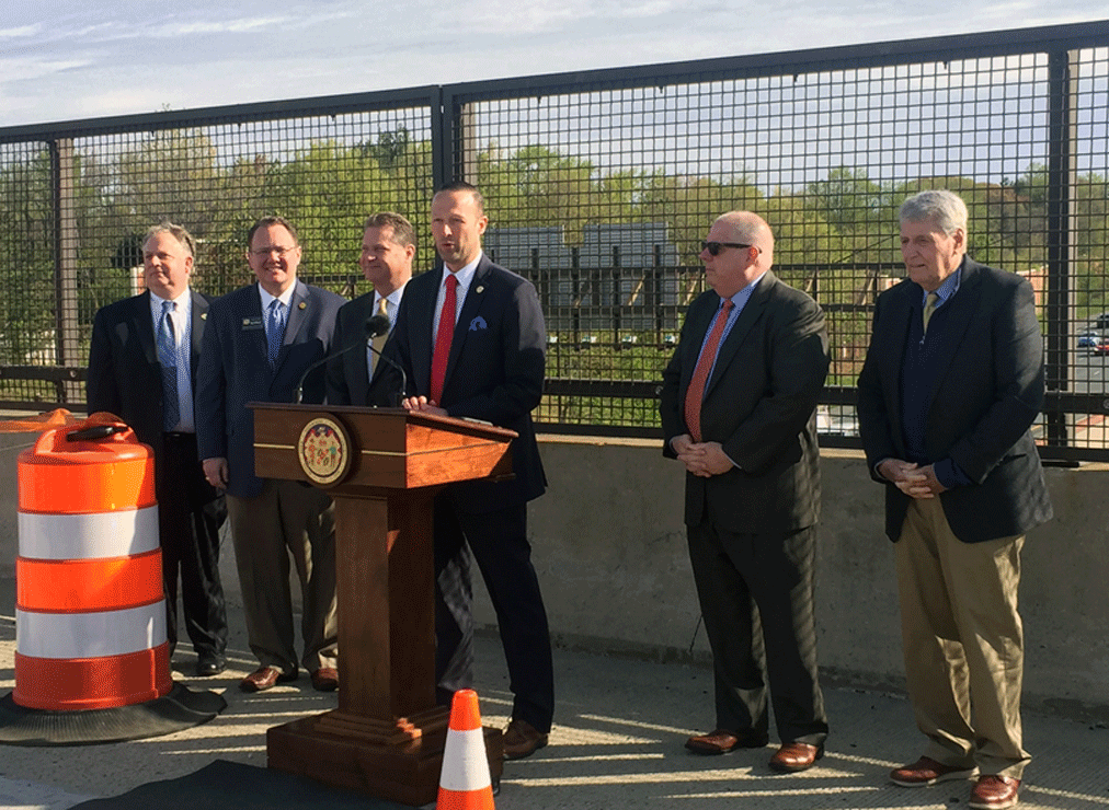 Officials are seen at a ribbon cutting ceremony for the new eastbound lanes of Route 50 that have been expanded from three to four lanes. (WTOP/Melissa Howell)