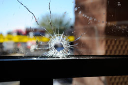 Bullet hole in front window of grocery store where the January 8, 2011 shooting by Jared Lee Loughner occurred in Tucson, Arizona. (Courtesy photo FBI)