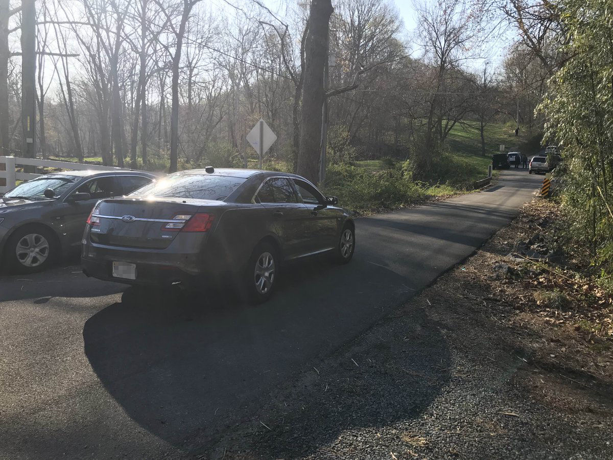 Detectives with the Fairfax County Police Department on the scene of an apparent homicide on Cochester Road. (Courtesy Fairfax County Police Department via Twitter)