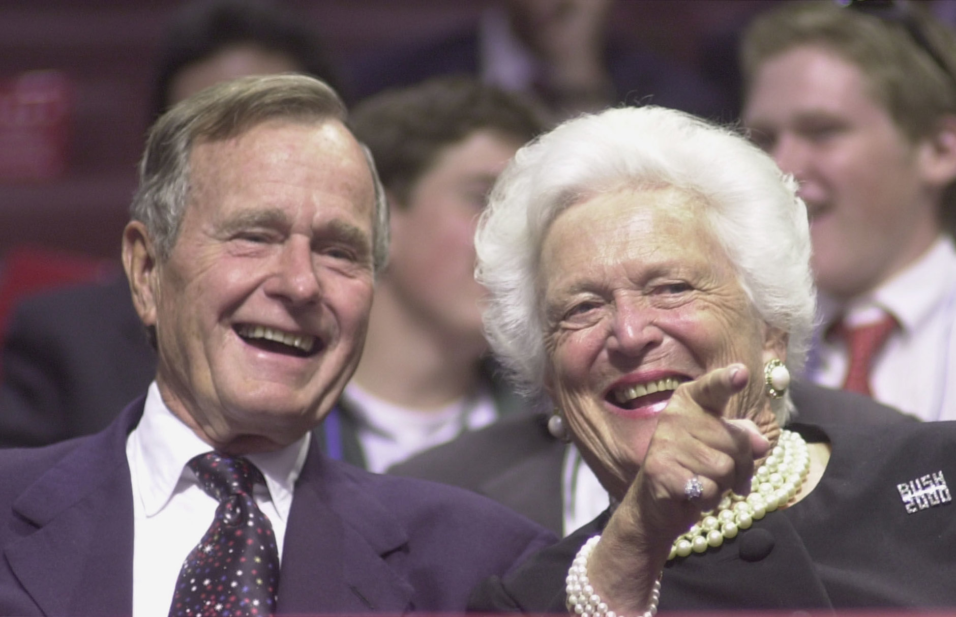374784 02: ,George and Barbara Bush point to well-wishers during the first day of the Republican National Convention, July 31, 2000 in Philadelphia. (Photo by Chris Hondros/Newsmakers)