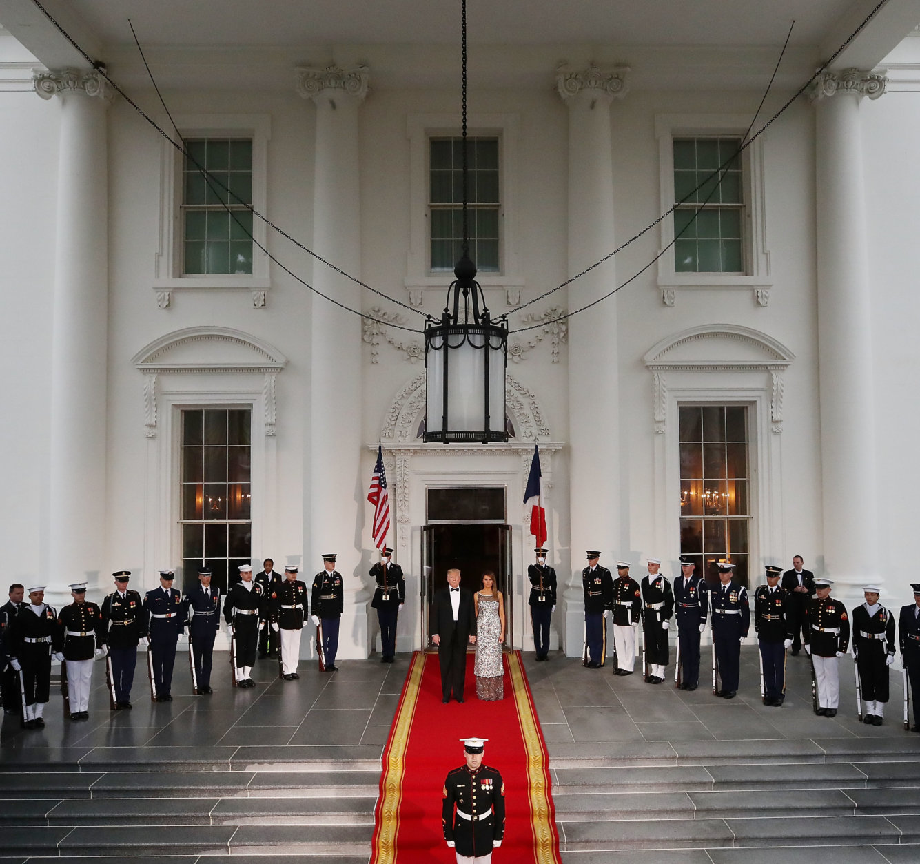 WASHINGTON, DC - APRIL 24:  U.S President Donald Trump, and U.S. first lady Melania Trump wait for the arrival of French President Emmanuel Macron, French first lady Brigitte Macron at the North Portico for before a State Dinner at the White House April 24, 2018 in Washington, DC. Trump is hosting Macron for a two-day official visit that included dinner at George Washington's Mount Vernon, a tree planting on the White House South Lawn and a joint news conference.  (Photo by Mark Wilson/Getty Images)