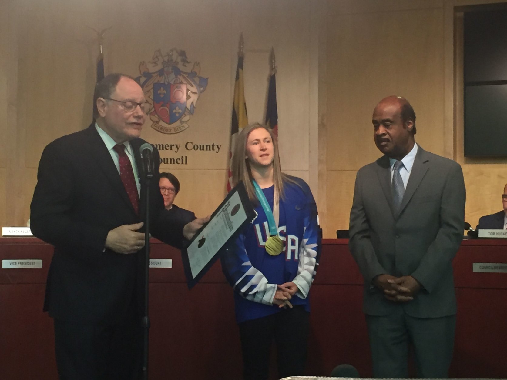 Councilmember Sidney Katz and County Executive Isiah Leggett presented Skarupa with a proclamation recognizing her achievements.  (WTOP/Melissa Howell)