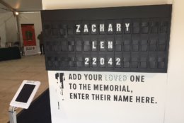 At the end of the memorial is a board that lets you remember anyone you know who died from an overdose.  Every few seconds a new name, with another number, is shown (Photo by John Domen). 