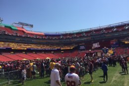  Some fans ran a 5K that ended in the field, while others simply perused the stands, many for the first time. (WTOP/John Domen)