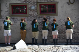 The Penguin Coast team at The Maryland Zoo spells out Millie's name on the back of their shirts. (Courtesy The Maryland Zoo)