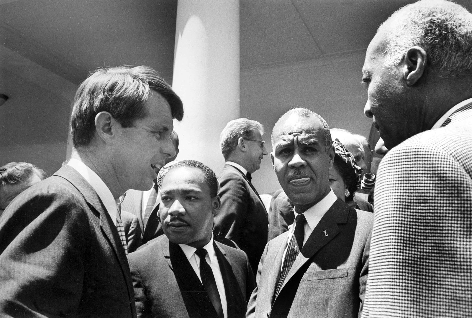 Attorney General Robert F. Kennedy talks with civil rights leaders on the White House grounds, June 22, 1963. From left: Kennedy; Rev. Martin Luther King, head of the Southern Christian Leadership Conference; Roy Wilkins, executive secretary of the NAACP, and A. Phillip Randolph, president, Brotherhood of Sleeping Car Porters. Joseph Rauh, civil rights lawyer, is in background at center. (AP Photo/Bob Schutz)
