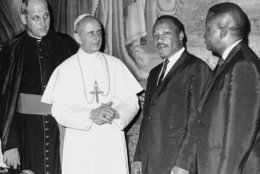In his photo released by the Vatican, Pope Paul VI poses at the Vatican with American civil rights leader Dr. Martin Luther King, Jr., during a private audience, Sept. 18, 1964.  With the pontiff and King are Msgr. Paolo Marcinkus of Chicago, who acted as interpreter, and with King is his aide, Dr. Ralph Abernathy, right. (AP Photo/Vatican Photo)