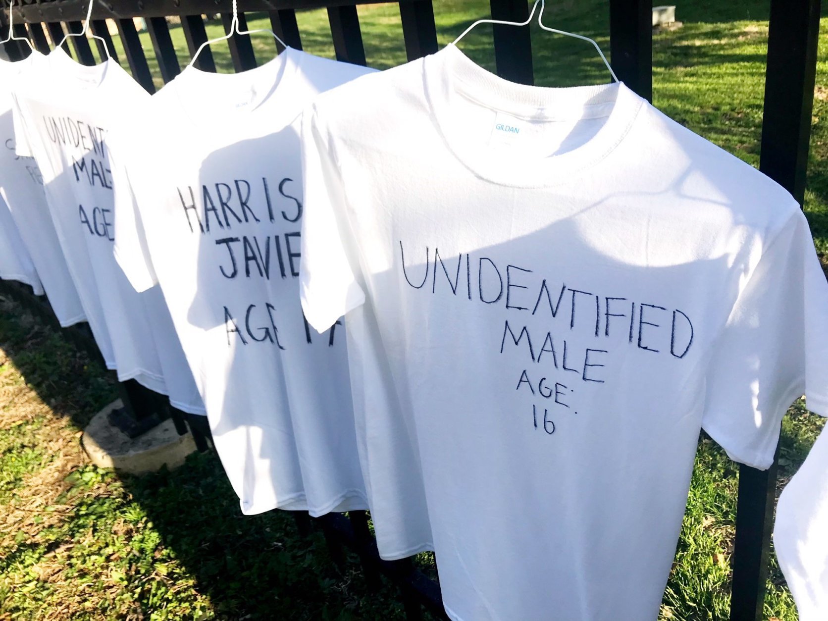 199 t-shirts, each representing a 2018 teen victim of gun violence hangs on the fence of Bethesda-Chevy Chase High School. (WTOP/Neal Augenstein)