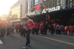 Fans gather outside the Capital One arena in Washington, D.C. during the first game of the first round of the Stanley Cup Playoffs between the Washington Capitals and the Columbus Blue Jackets, Thursday, April 12, 2018. (WTOP/Mike Murillo)