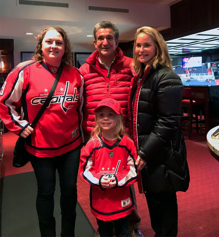 Keelan Moxley and her mother meet with Ted and Lynn Leonsis. (Courtesy Monumental Sports & Entertainment)