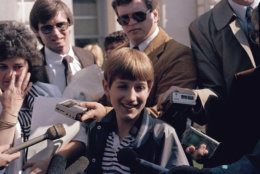 Teenage AIDS victim Ryan White is surrounded by friends and reporters after a judge threw out a temporary injunction barring him from attending classes at Western Middle School near Kokomo, Ind., April 10, 1986. Ryan's mother Jeanne is at left and attorney Charles V. Vaughn is at rear.  (AP Photo)