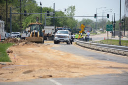 Crews hauled in sand to stop the spread of the spilled fuel. (WTOP/Dave Dildine)