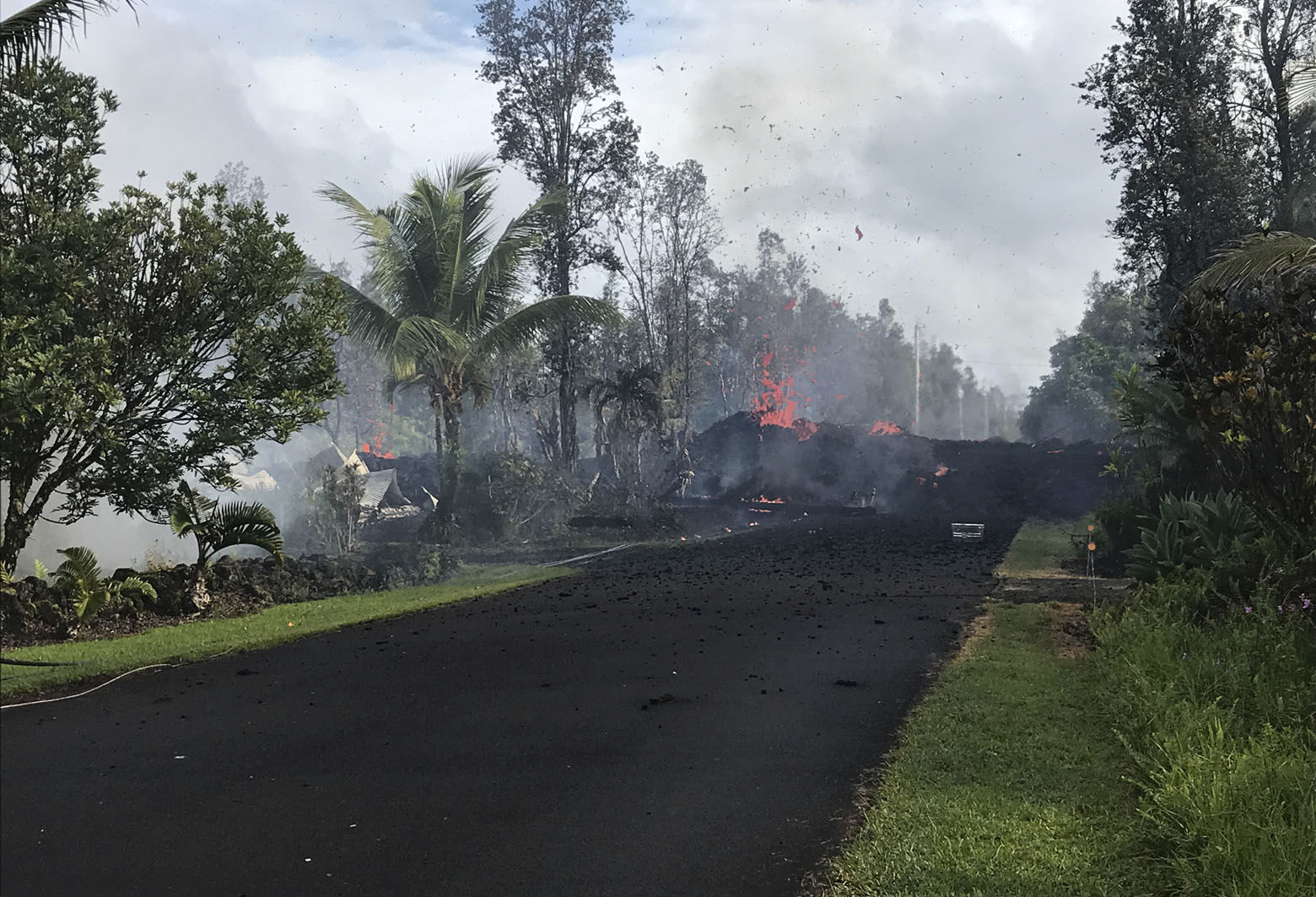 In this Friday, May 4, 2018, image released by the U.S. Geological Survey, shows fissure 3 at Leilani and Kaupili Streets in Leilani Estates subdivision at 8:07 a.m. HST near Pahoa, Hawaii. The Kilauea volcano sent more lava into Hawaii communities Friday, a day after forcing more than 1,500 people to flee from their mountainside homes, and authorities detected high levels of sulfur gas that could threaten the elderly and people with breathing problems. (U.S. Geological Survey via AP)