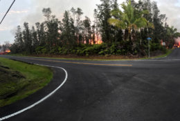 PAHOA, HI - MAY 5: In this handout photo provided by the U.S. Geological Survey, a panoramic view of a fissure errupting lava from the intersection of Leilani and Makamae Streets after the eruption of Hawaii's Kilauea volcano on May 5, 2018 in the Leilani Estates subdivision near Pahoa, Hawaii. The governor of Hawaii has declared a local state of emergency near the Mount Kilauea volcano after it erupted following a 5.0-magnitude earthquake, forcing the evacuation of nearly 1,700 residents. (Photo by U.S. Geological Survey via Getty Images)