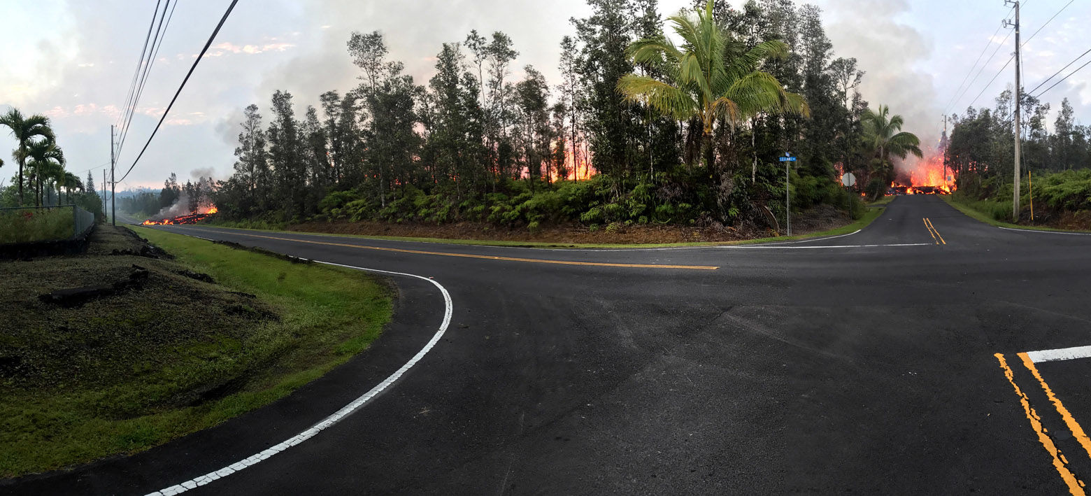 PAHOA, HI - MAY 5: In this handout photo provided by the U.S. Geological Survey, a panoramic view of a fissure errupting lava from the intersection of Leilani and Makamae Streets after the eruption of Hawaii's Kilauea volcano on May 5, 2018 in the Leilani Estates subdivision near Pahoa, Hawaii. The governor of Hawaii has declared a local state of emergency near the Mount Kilauea volcano after it erupted following a 5.0-magnitude earthquake, forcing the evacuation of nearly 1,700 residents. (Photo by U.S. Geological Survey via Getty Images)