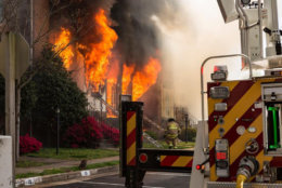 By the time firefighters arrived, several town houses were already on fire and the flames had spread to a second row of town houses. (Courtesy Brent Schnupp/Fairfax County Fire and Rescue)