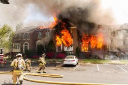 Several of the houses were engulfed in flames, a total of 13 were damaged and three dozen people were displaced. The losses from the May 2 blaze are estimated at $2.2 million. (Courtesy Brent Schnupp/Fairfax County Fire and Rescue