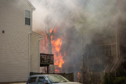By the time firefighters arrived, several town houses were already on fire and the flames had spread to a second row of town houses. (Courtesy Brent Schnupp/Fairfax County Fire and Rescue)